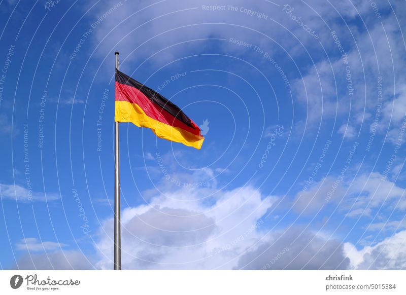 German flag on pole against blue sky Germany Sky Blue Europe National Flag Patriotism German Flag Blow Politics and state Flagpole Ensign