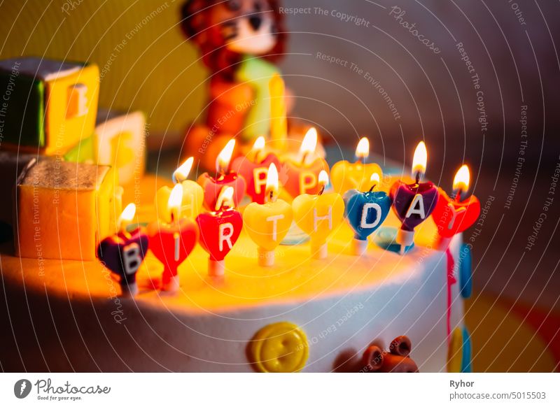 Happy Birthday Written In Lit Candles On Colorful Cake text decoration childhood light pie happy birthday bakery beautiful fun party holiday pastry year orange