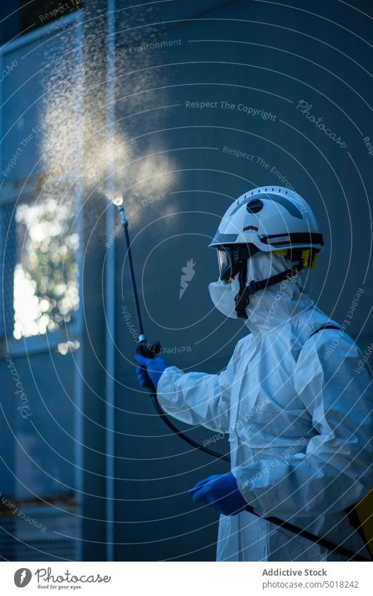 Closeup of a firefighter disinfecting the walls of a building fireman covid19 people person gas virus training pandemic protection activity industry scientist