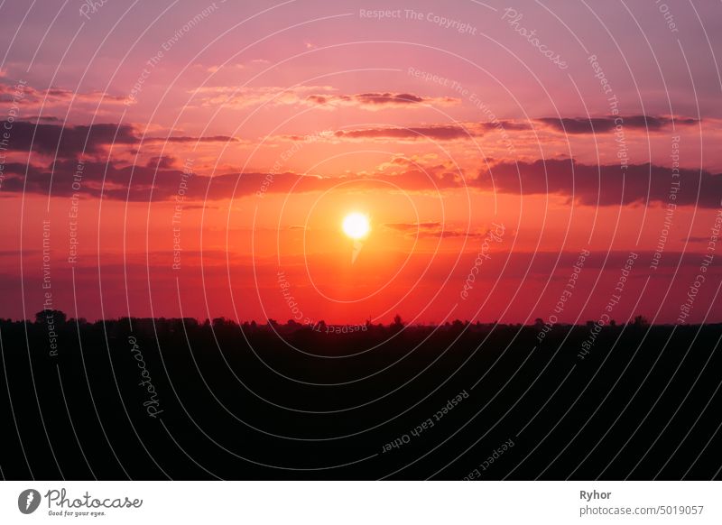 Sun Shining Over Dark Ground During Sunrise. Sunset Sky Landscape silhouette view dark weather cloudscape red natural relax pink evening scene sky sunset beauty