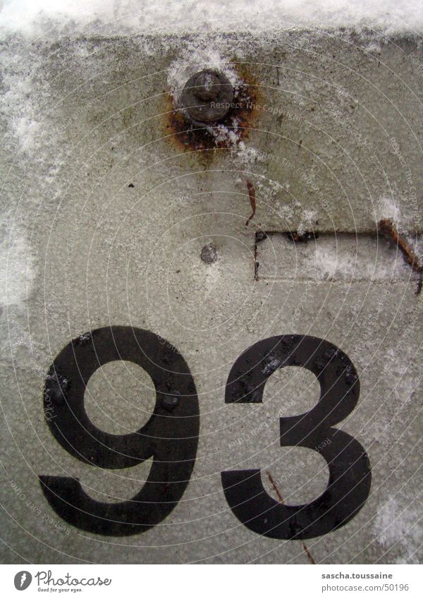 Icy ninety-three > 93 Ice Snow Winter Rust Tin Level Metal Screw Weather Black Gray Detail Transience Digits and numbers Decline Derelict Weathered