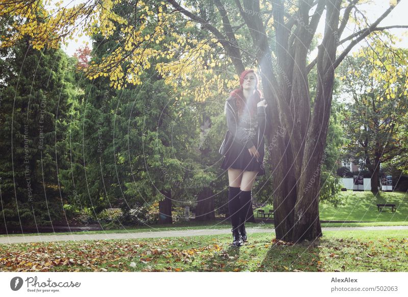 Portrait in autumn Young woman Youth (Young adults) Legs 18 - 30 years Adults Beautiful weather Tree Grass Autumn leaves Park Meadow Skirt Jacket Sock Boots