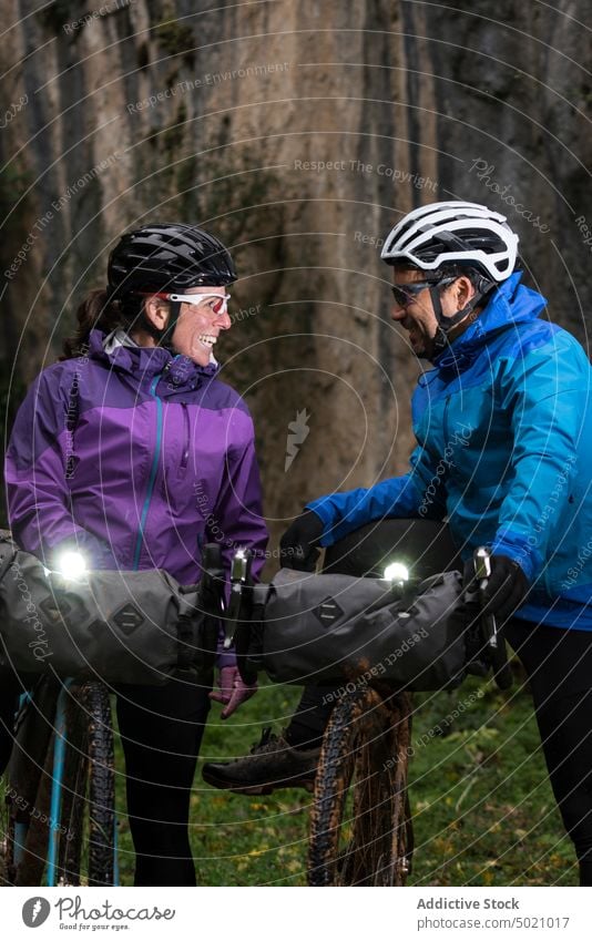 People with bicycle lights in greed place people equipment adventure active protective glasses nature hide helmet cyclist sport lifestyle speed ride recreation