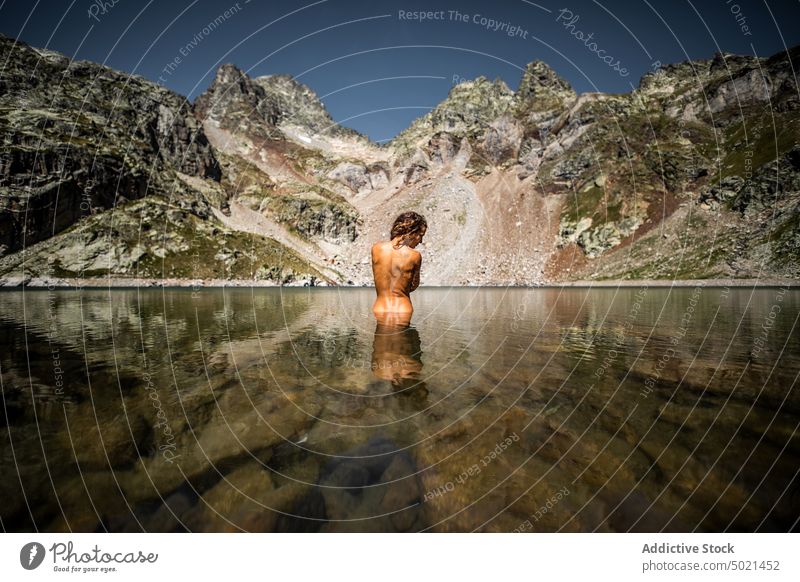 Woman taking bath in mountain lake woman water nature landscape grace beauty roc