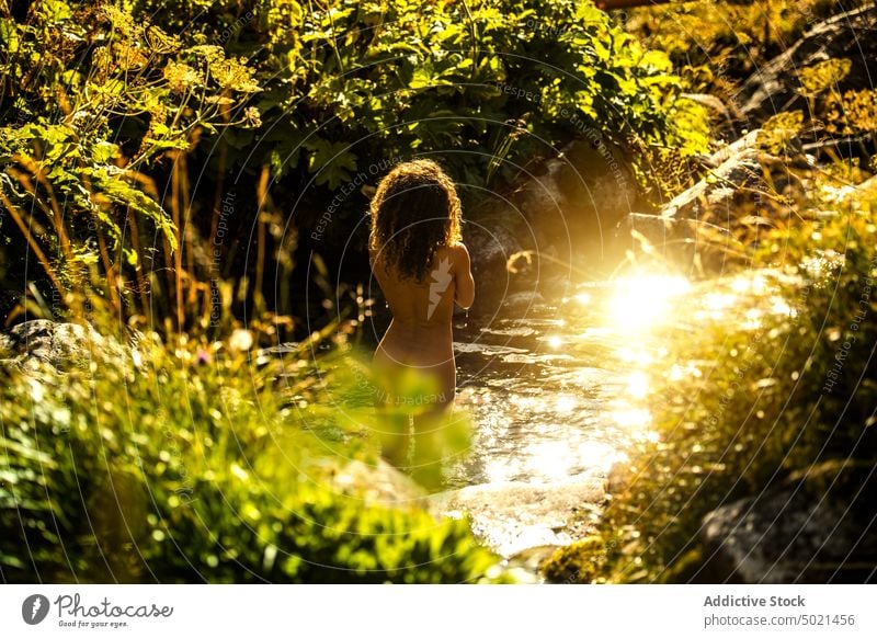 Woman taking bath in mountain river woman summer nature stream traveler landscape green water stone female rock tourism environment relax peaceful harmony fresh