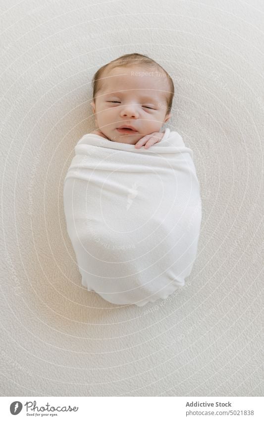 Cute infant wrapped in blanket baby sleep soft tender innocent cute little kid lying childhood adorable peaceful newborn comfort rest tranquil coverlet plaid