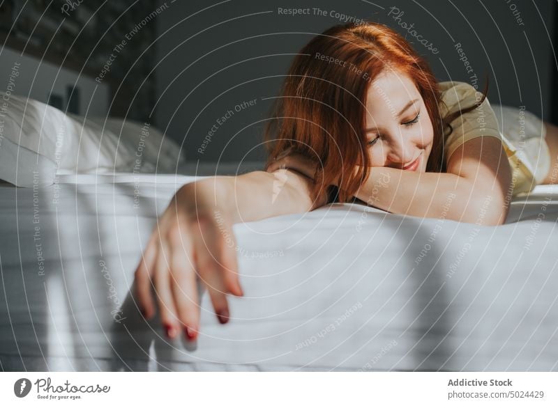 Young Lovely Woman Resting On Bed woman bed indoors bedroom leisure attractive beautiful bedding blurred background closed eyes comfort comfortable copy space