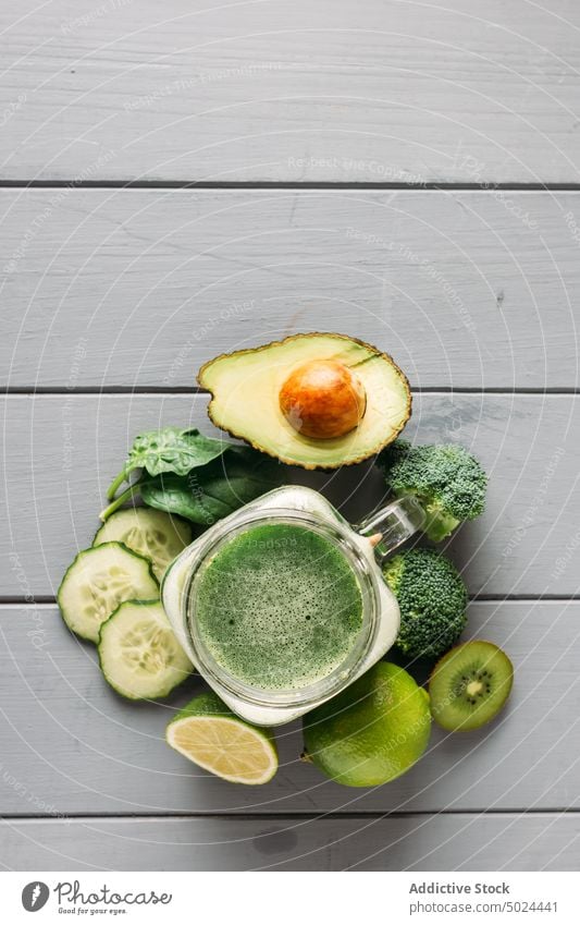 Ingredients for a detox juice apple avocado blade broccoli citrus fruit color cooking cucumber desktop diet dining table food freshness from above furniture