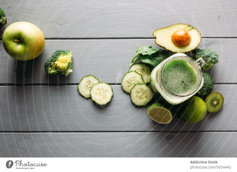 Ingredients for a detox juice apple avocado blade broccoli citrus fruit color cooking cucumber desktop diet dining table food freshness from above furniture
