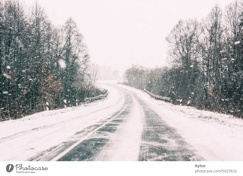 Snow-covered Open Road During A Winter Snowstorm. Adverse Weather Conditions transport blizzard nature safety road frozen snow cold danger condition asphalt