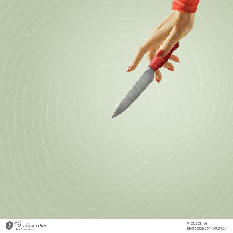Women hand with kitchen knife at green background women red object people tool