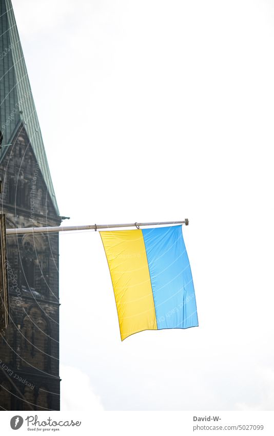 Ukrainian flag with church tower in background Ukraine Flag Church Belief War Hope Fear God pray Peace symbol concept Sign
