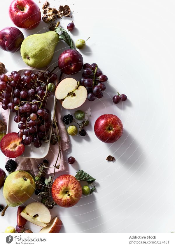Flatlay with ripe autumn fruits nature juicy branch fall agriculture nutrition closeup group plum bright health farm composition pear blackberry flatlay object