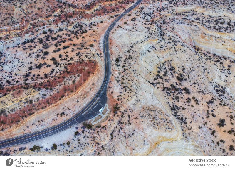 Drone view of asphalt road going through sandy valley in Utah highway mountain landscape Scenic Byway 12 roadway scenery route nature highland picturesque