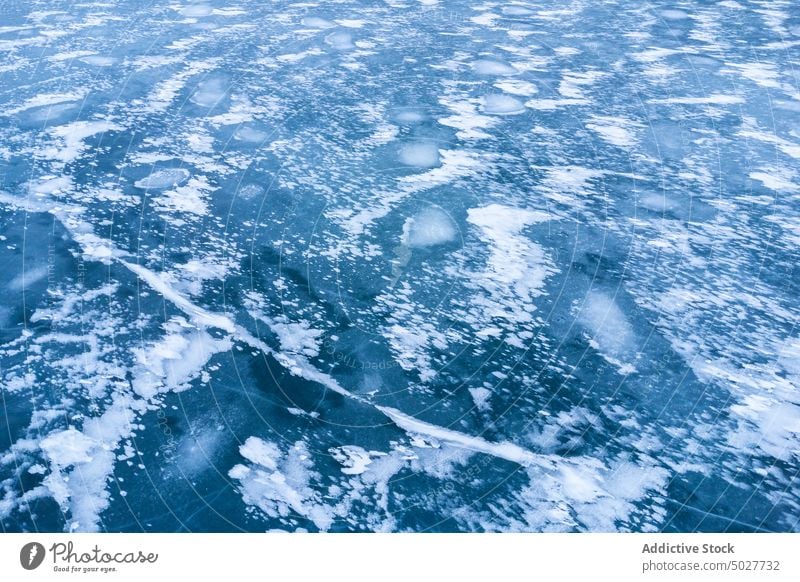 Frozen lake in winter ice glacier frozen nature north background geology cold environment weather rough season scenic snow arctic abstract solid surface