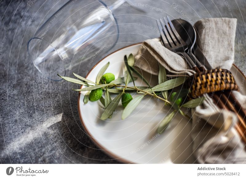 Rustic summer table setting autumnal ceramic cutlery dinner dinnerware eat eating food fork knife leaves meal napkin olive peace place plate rustic silverware