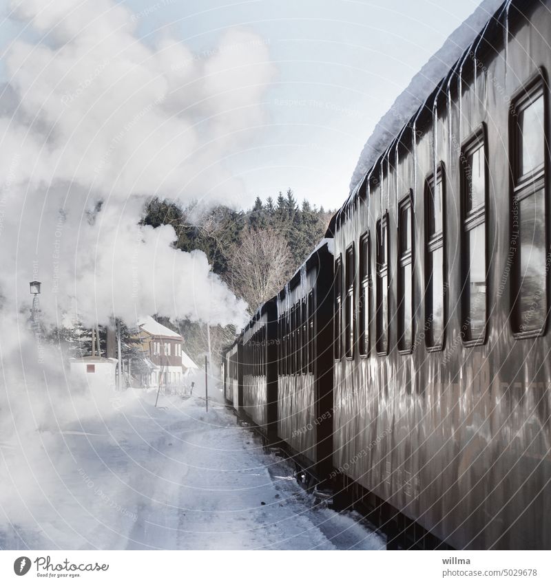 Railroad romance with the old steam locomotive rail journey Wagons railway carriages Historic Steam Locomotive Steamlocomotive Winter Snow winter Winter's day