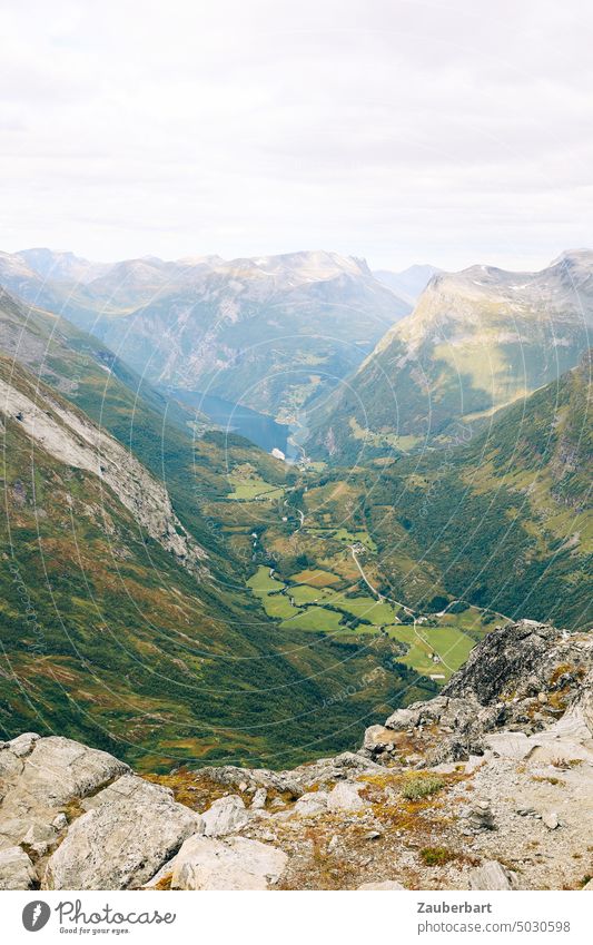 Mountain landscape in South Norway with Geirangerfjord Fjord mountains Valley Looking panorama Fog Haze Green Landscape wide holidays vacation travel