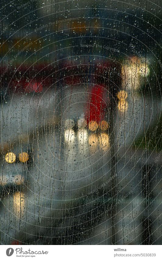 Driving in poor visibility Rain Rainy weather rainy day raindrops Window pane Floodlight clearer Headlamp Street cars Drops of water Bad weather Light circles