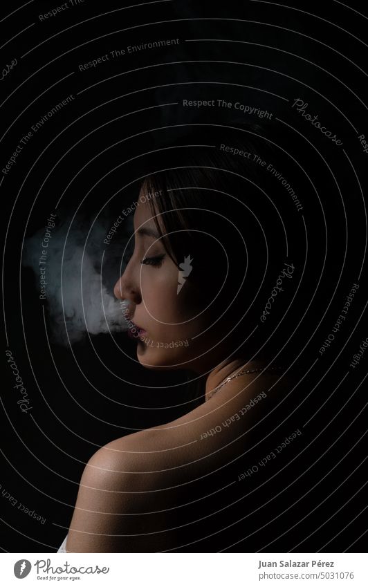 woman smoking a cigarette with unique style. Smoking Cigarette Nicotine Nicotine odour Dependence Addictive behavior Smoke Pulmonary disease Addiction