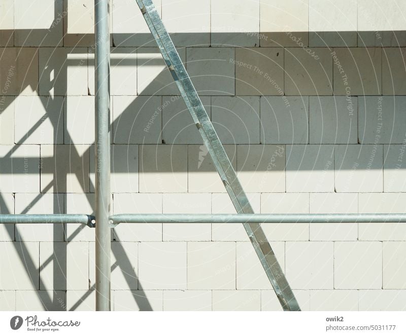 Big A Construction site Wall (building) Build Scaffolding factual white wall Wall blocks White Bright Stone Rustic Sunlight Beautiful weather detail Arrangement