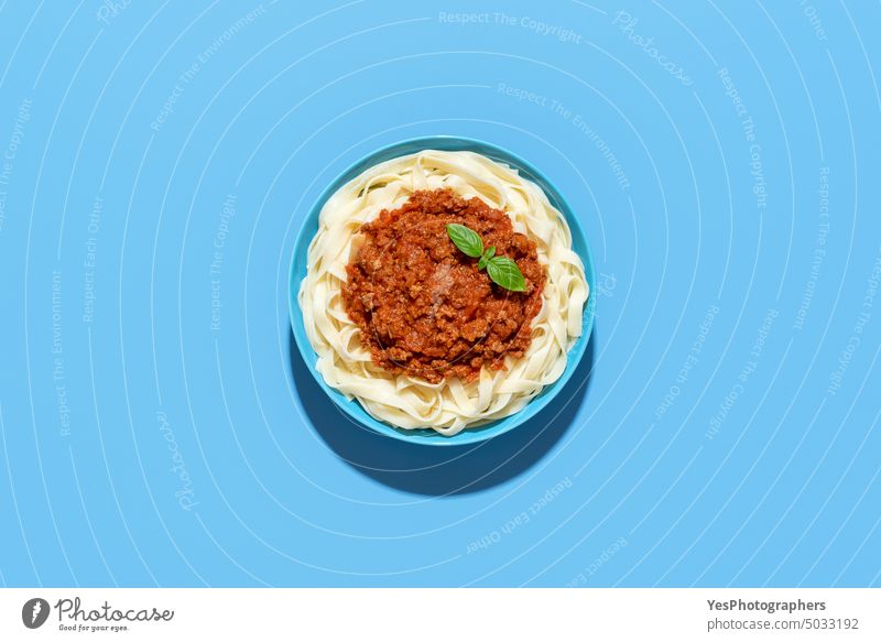 Bolognese tagliatelle dish top view, isolated on a blue background above beef bolognese bowl bright carbs classic color cooked copy space creative cuisine