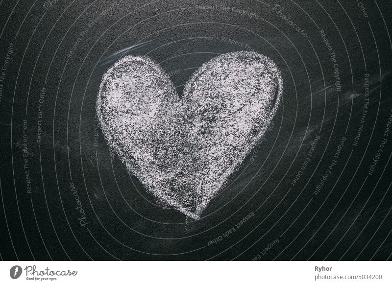 Love Heart Drawing On A School Chalkboard. Handwritten Message On A School Chalkboard Drawing With An Illustrated Heart Used As A Symbol, Concept Of Love In This Valentines Message