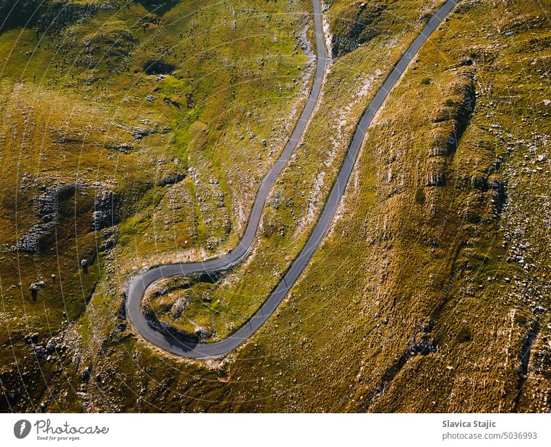 Mountain Pass With Curved Road, detail.  Panoramic road in Durmitor National Park, Zabljak, Sedlo pass,  Montenegro. Aerial, drone view above aerial asphalt