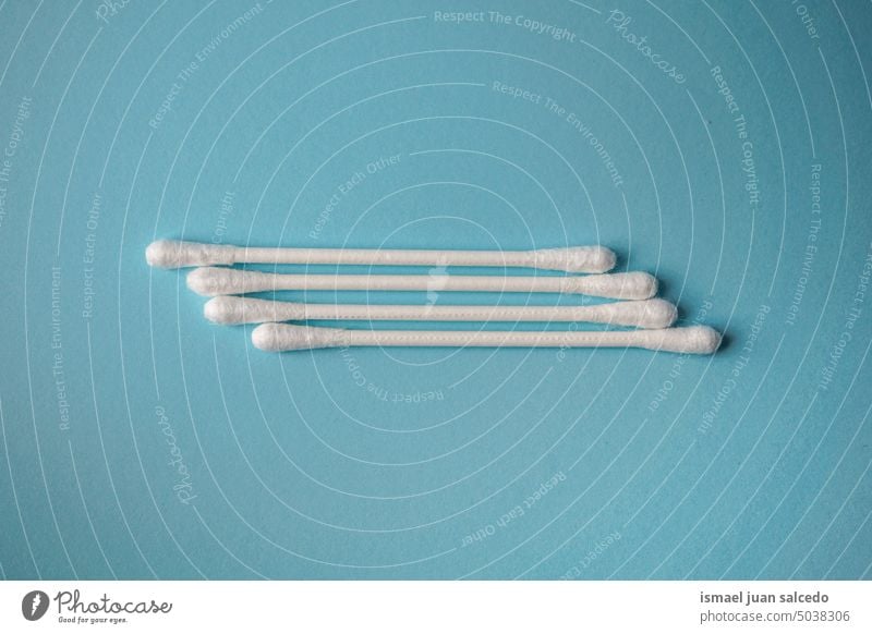 cotton swabs on the blue background, personal hygiene tool hygienic hygienic product cotton buds object stick clean medicine white medical care healthy cosmetic