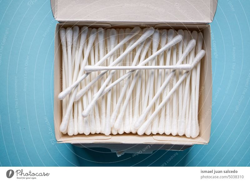 white cotton swabs on the blue background tool hygiene hygienic hygienic product cotton buds object stick clean medicine medical care healthy cosmetic soft