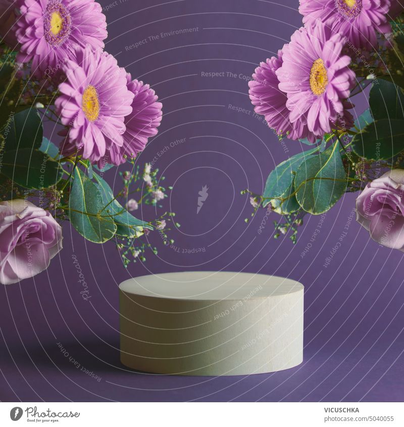 Purple product display with podium and pink flowers bunch frame. Scene stage showcase. Front view with copy space. purple scene front view abstract advertising