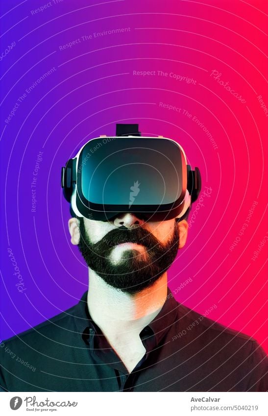 Hipster man wearing VR headset, concept portrait big beard, big moustache, modern people activities. goggles cyber entertainment future futuristic game gaming