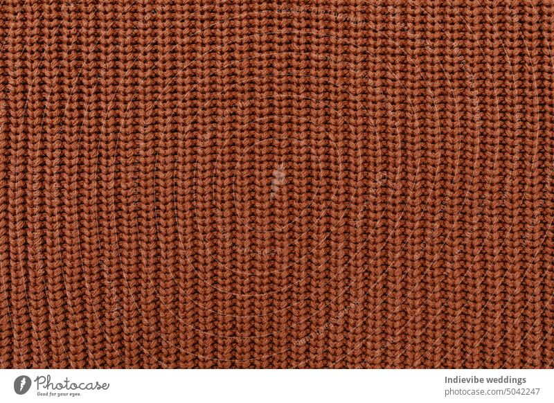 Brown knitted wool fabric texture. Flat lay, top view, closeup, copy space. brown textile pattern material rough backgrounds linen alpaca cotton surface