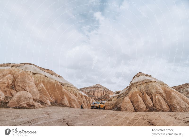 Picturesque view of rocky formations in desert landscape nature terrain geology cappadocia valley cloudy sky environment mountain scenery scenic spectacular