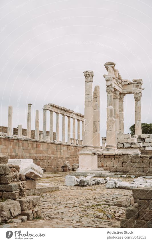 Old Greek ruins against cloudy sky column site ancient archaeology broken building architecture pergamon turkey gray heritage historic landmark overcast
