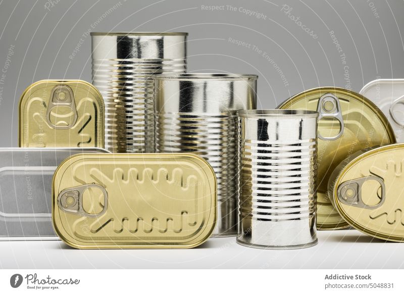 Set of stacked unopened cans tin metal tin can food container canned isolated product background packaging pattern aluminum conserve blank empty jar steel pile