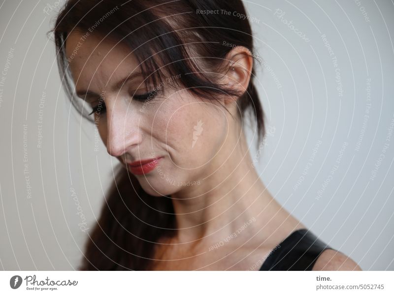Woman, thoughtful Meditative Dark-haired look Braids Long-haired Downward Face feminine Feminine portrait