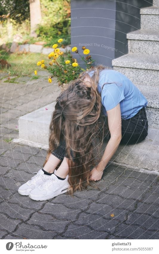 Young woman / teenager sits exhausted and powerless bent over head on stairs portrait Human being Woman Youth (Young adults) Feminine 13 - 18 years