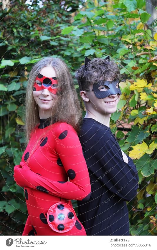 Siblings dressed up as superheroes, anime, cosplay, carnival, superstars Miraculous ladybug Cat Noir fantasy world teenager secret identity Marinette Costume