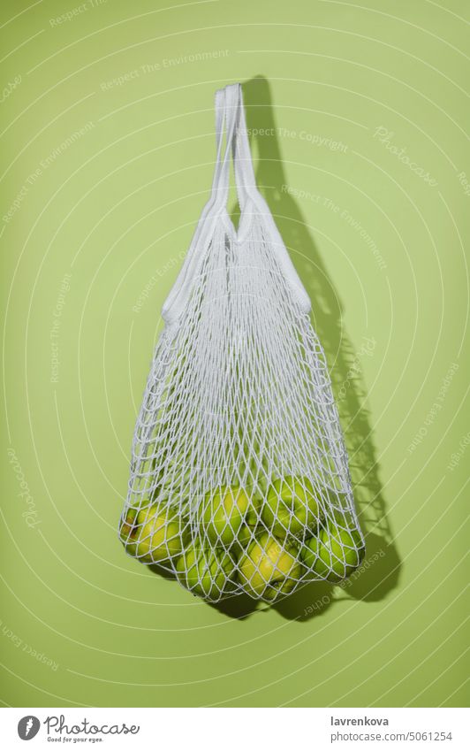Fresh green apples in a string bag, zero waste grossery shopping concept ecology environment food fresh ecofriendly fruits grocery harvest healthy lifestyle