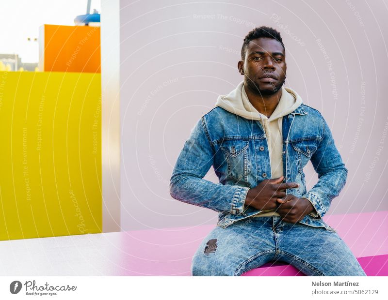 Portrait of a black man with casual clothes on colorful background guy model casual attire male look posing fashionable portrait afro people clothing adult
