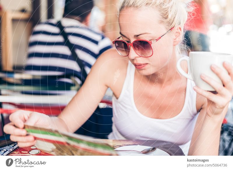 Woman drinking coffee outdoor on street. woman restaurant girl bar beautiful young female cup italy italian happy people adult person cafe pretty lady tea