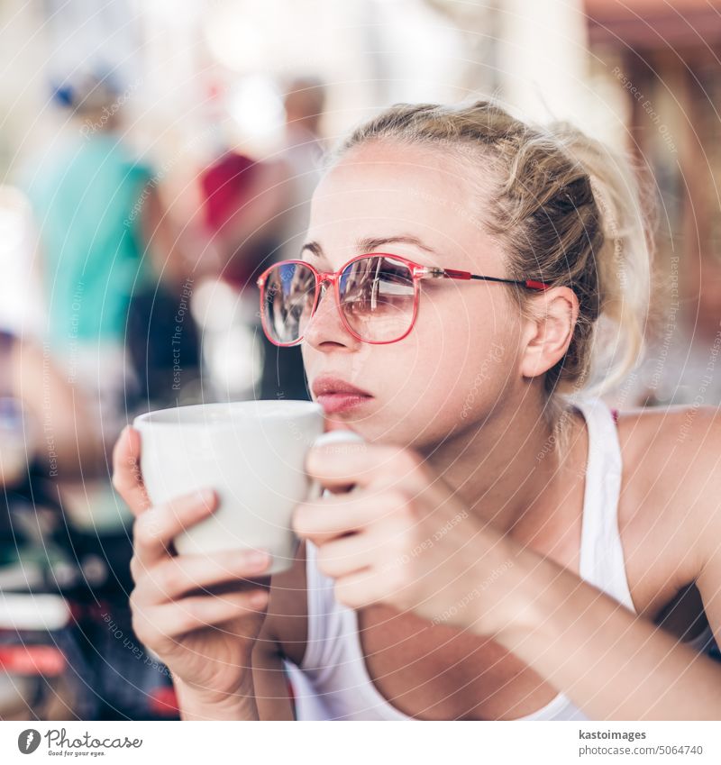 Woman drinking coffee outdoor on street. woman restaurant girl bar beautiful young female cup italy italian happy people adult person cafe pretty lady tea