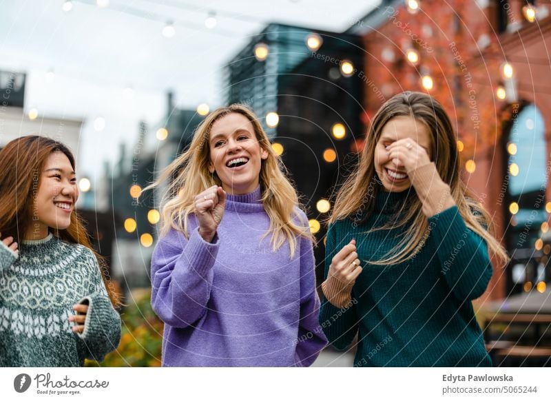 Group of female friends having fun in the city real people candid woman girls young adult friendship girlfriends girl power urban city life youth millennials