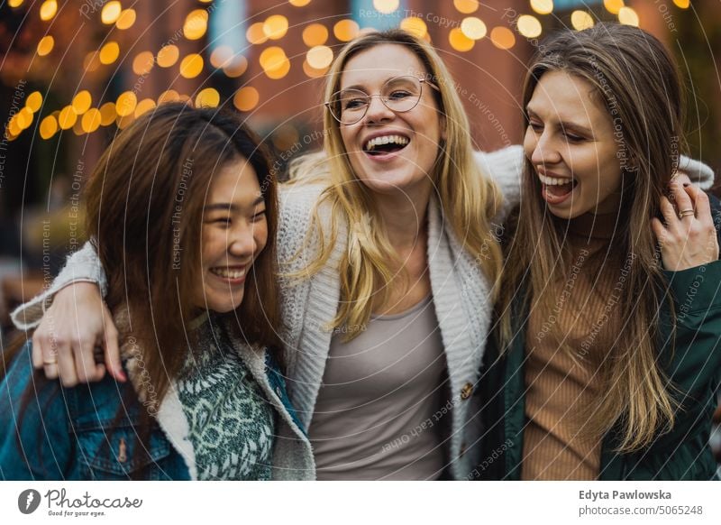Group of female friends having fun in the city real people candid woman girls young adult friendship girlfriends girl power urban city life youth millennials