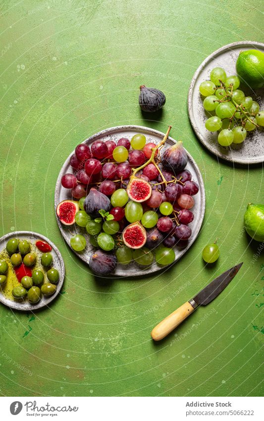 Wooden tray with ripe fruits grape red fresh bunch fig sweet food healthy food natural organic season vegetarian dessert vitamin rustic harvest refreshment
