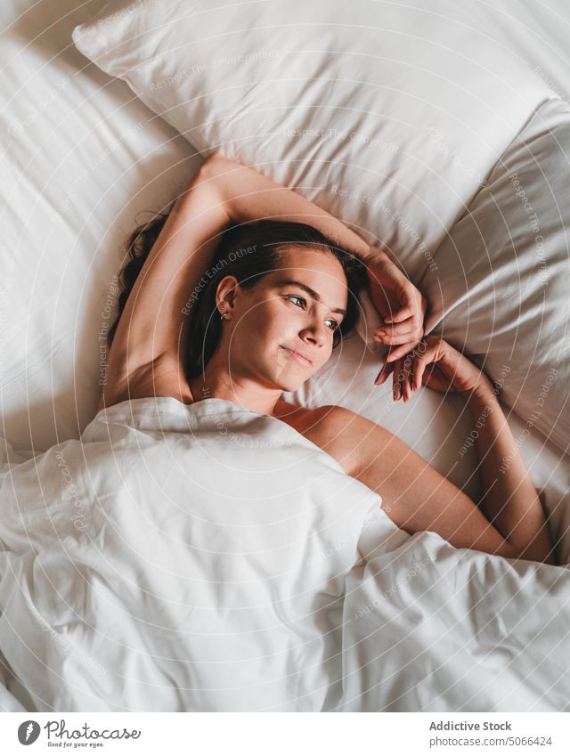 Dreamy woman lying on bed morning home rest daydream comfort bedroom lazy calm relax duvet cozy peaceful blanket tranquil serene soft harmony pillow weekend