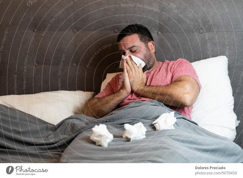 Middle-aged man in bed sick with flu symptoms 30 people ache alone apartment beard cold cold symptom coronavirus covid depressed disease entrepreneur exhausted