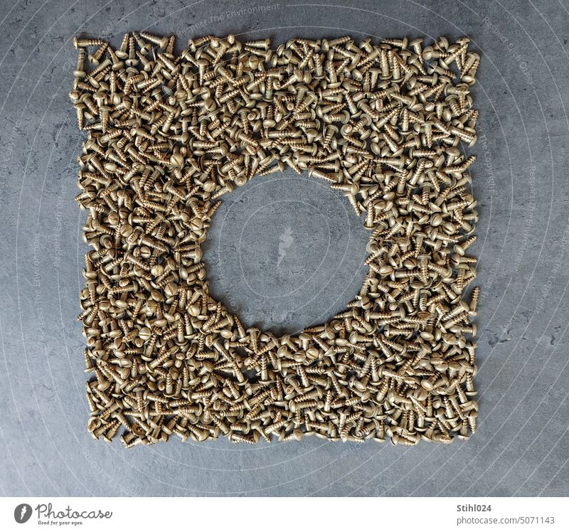 many brass wood screws arranged as a square - with circular hole in the middle Screw Wood screw Brass screw Square Circle Hollow background Black mottled Frame