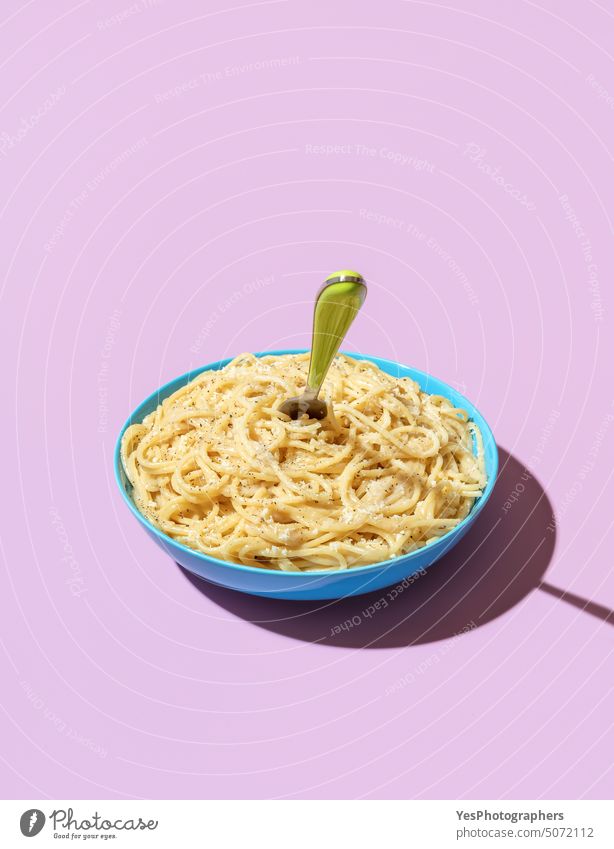 Cheese spaghetti bowl isolated on a purple background bright cacio e pepe carbs cheese color cooked copy space creative cuisine cut out delicious dinner dish